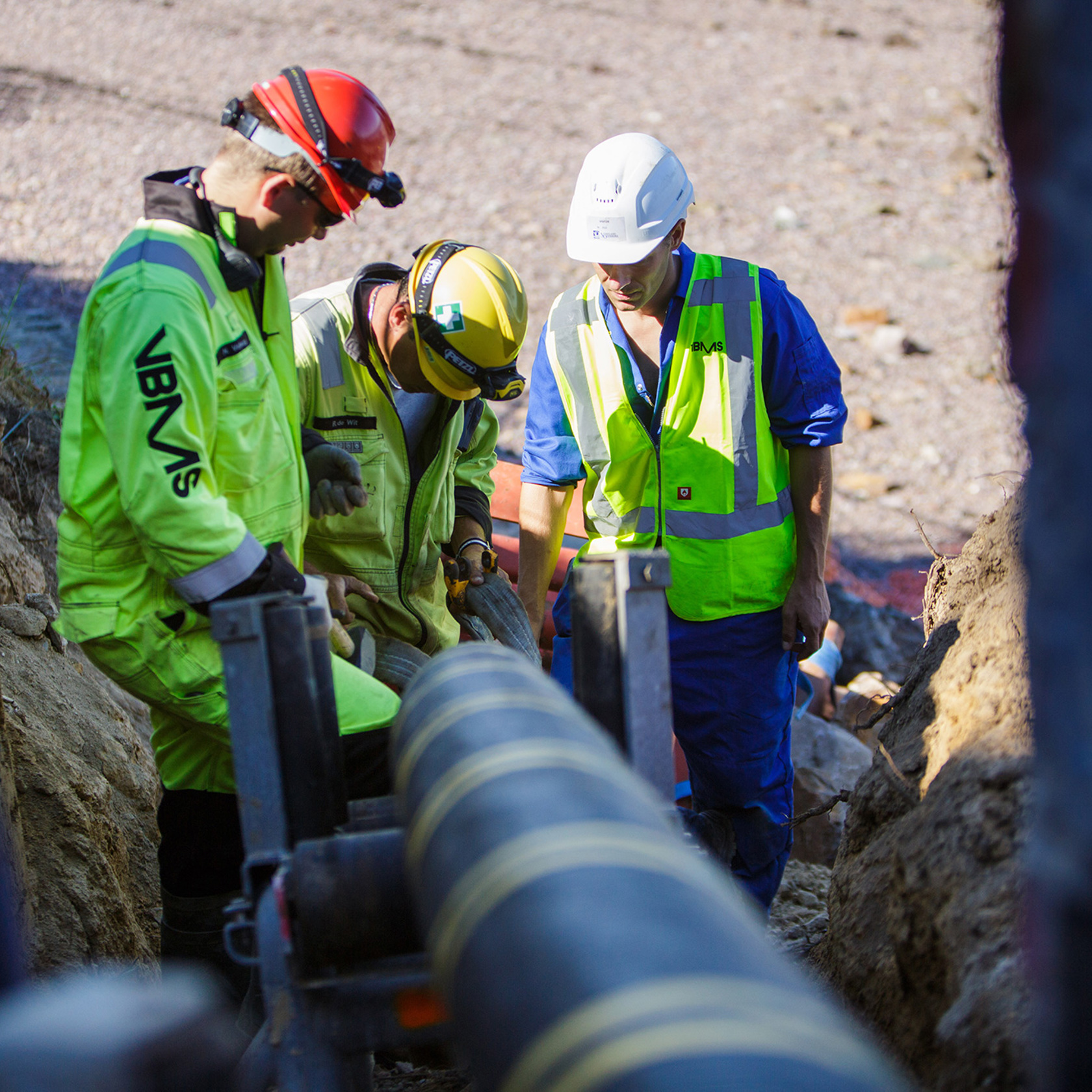 Workmen inspect an undersea power cable