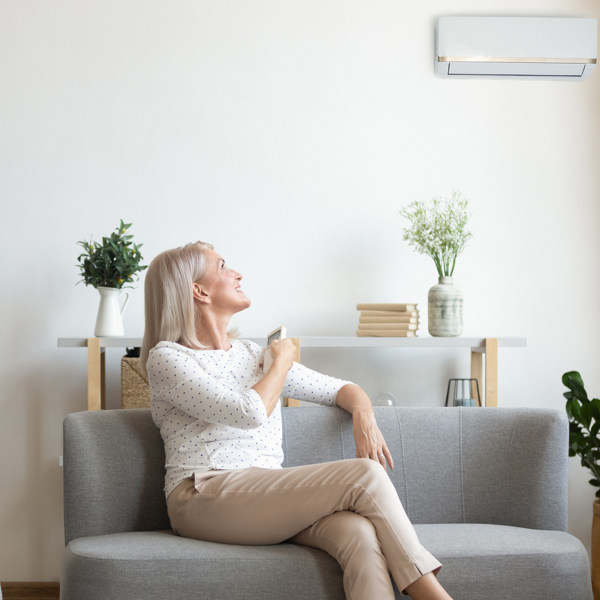 Woman using heat pump at home