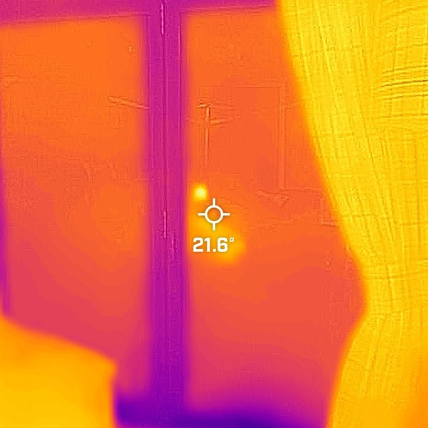 Thermal image from indoors of patio doors with the curtains open