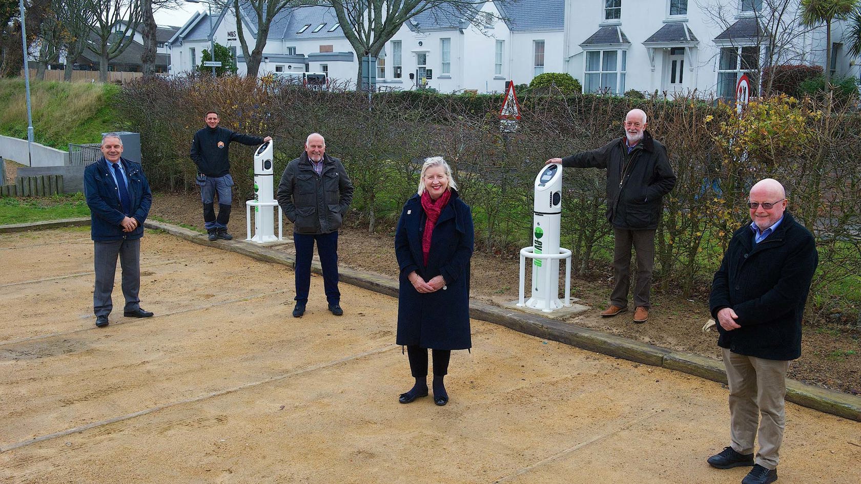 JE team and parishioners display new electric charging points