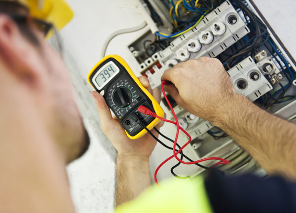 An electrician carries out maintenance.