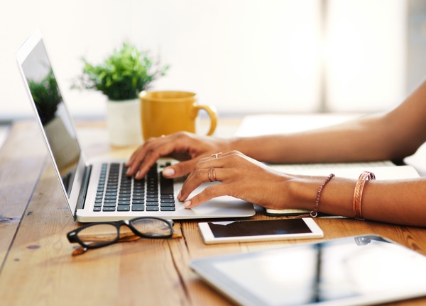Woman using a laptop at home
