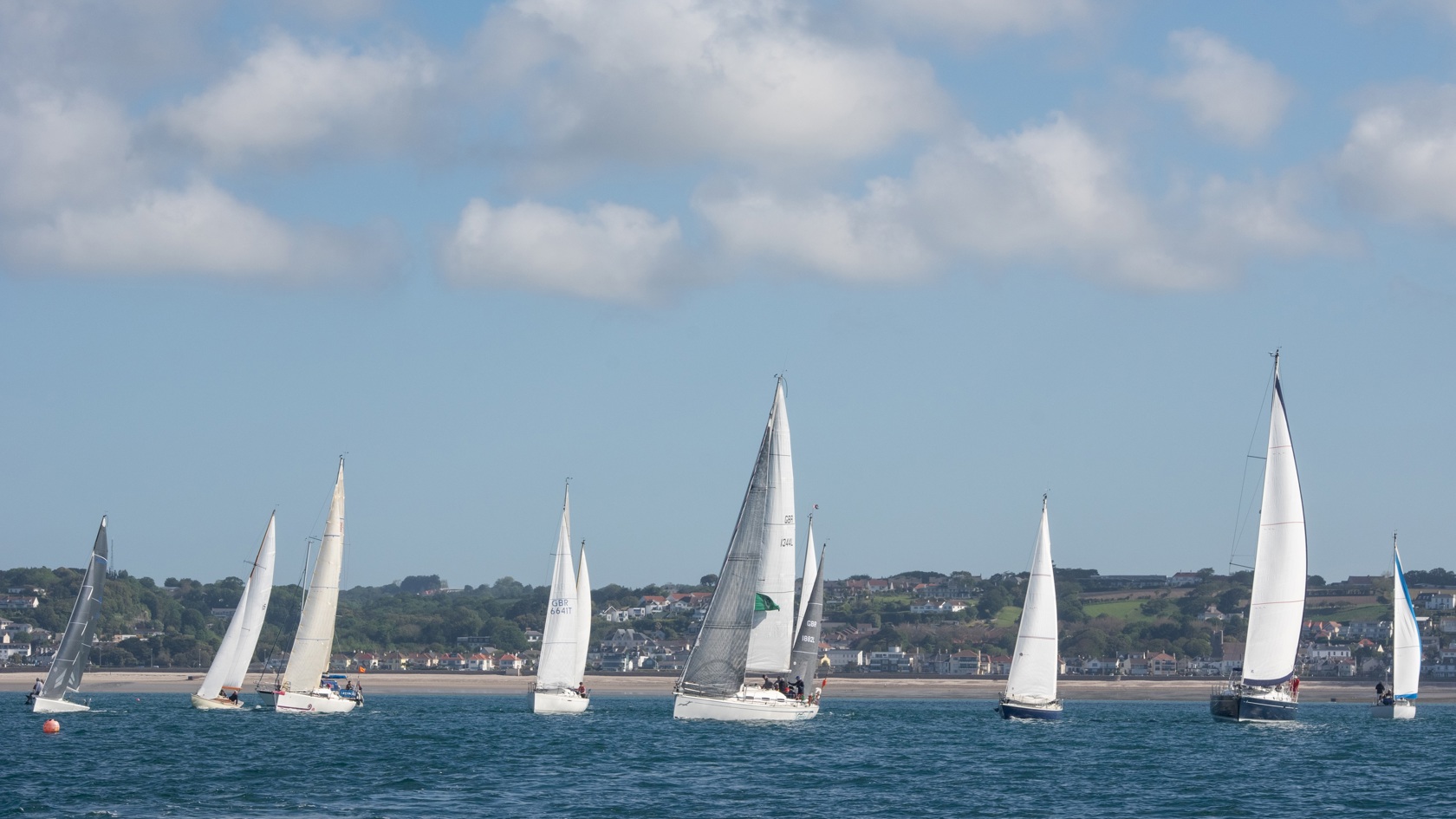 Sailing boats racing in St Aubins Bay