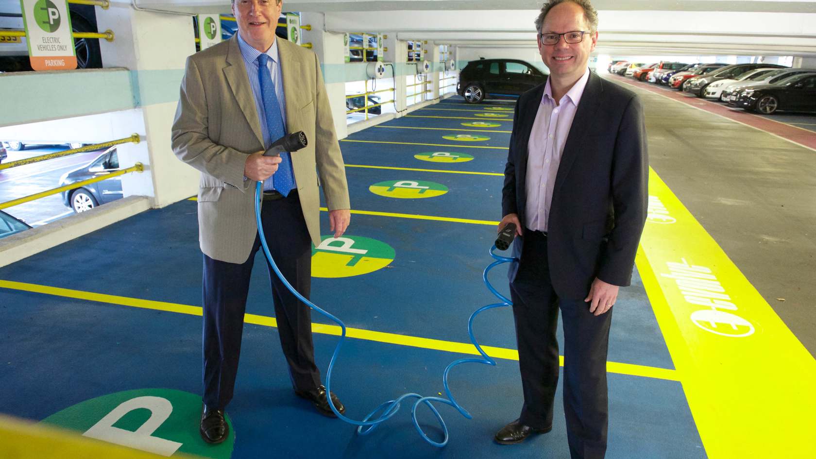 Chris Ambler and Kevin Lewis with new Pier Road electric vehicle chargers
