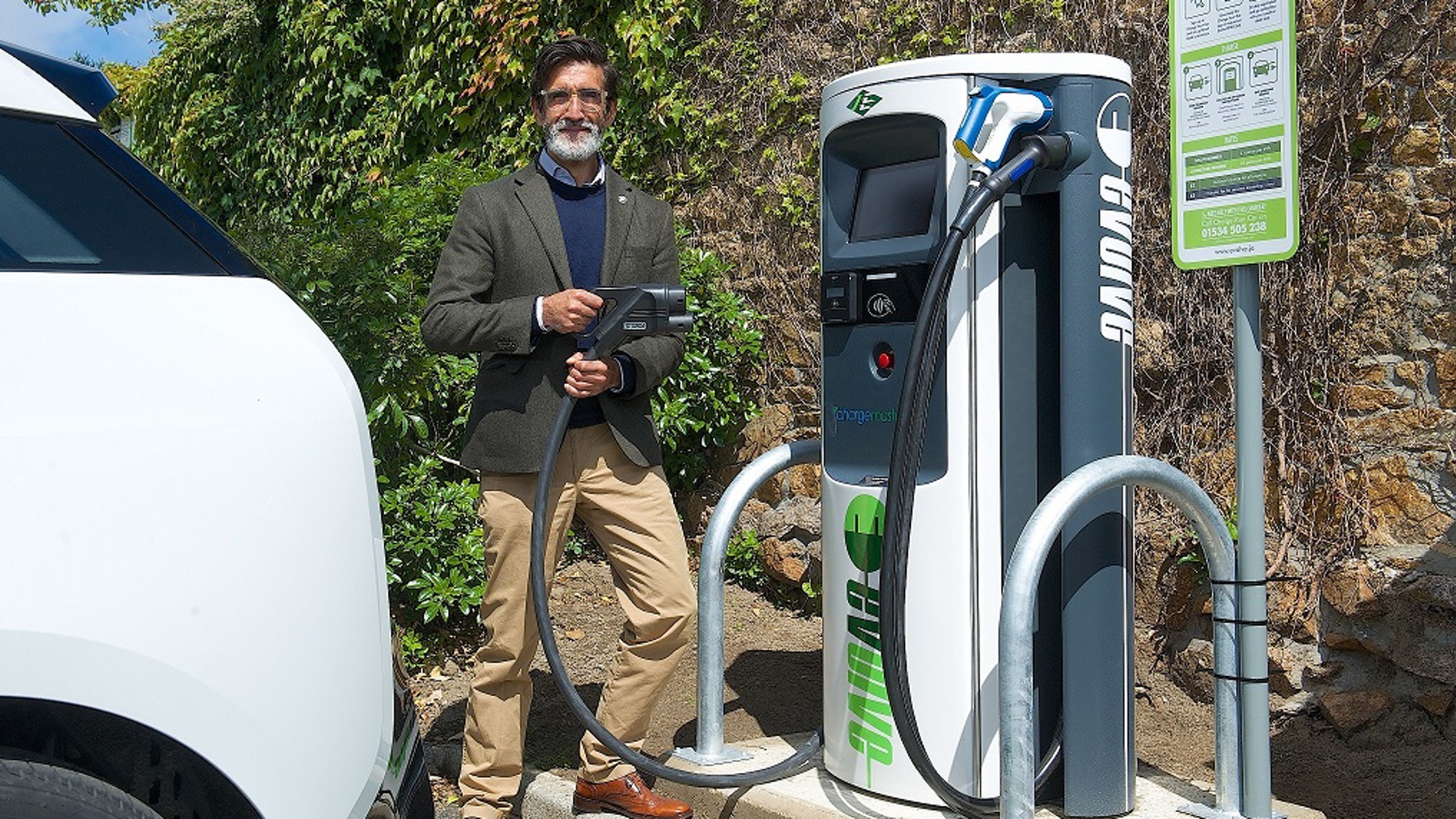 Andrew Welsby demonstrates the rapid electric vehicle charger at Red Houses.