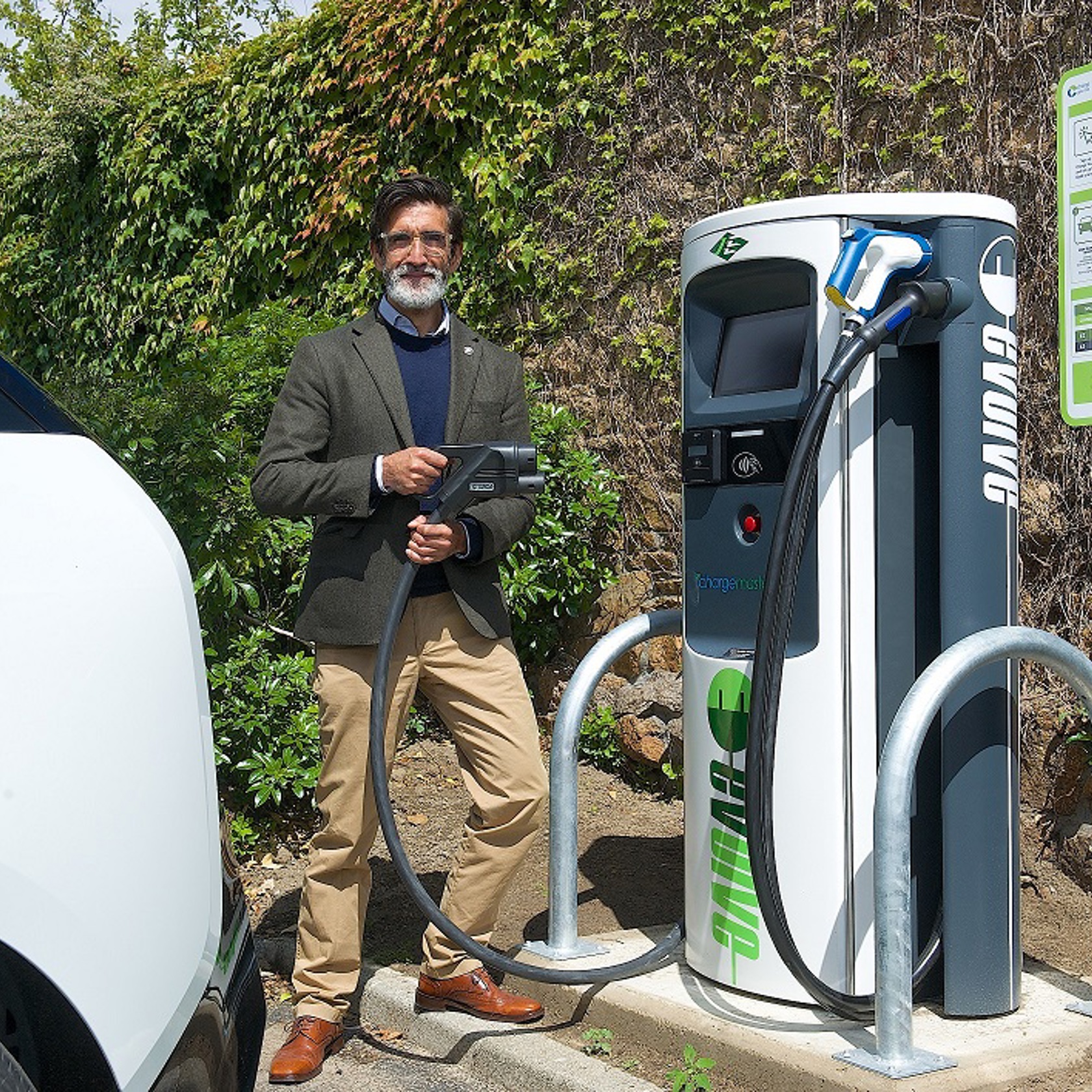 Andrew Welsby demonstrates the rapid electric vehicle charger at Red Houses.