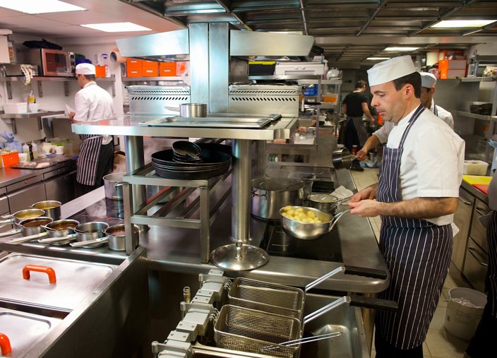 Chefs cooking in a commercial kitchen
