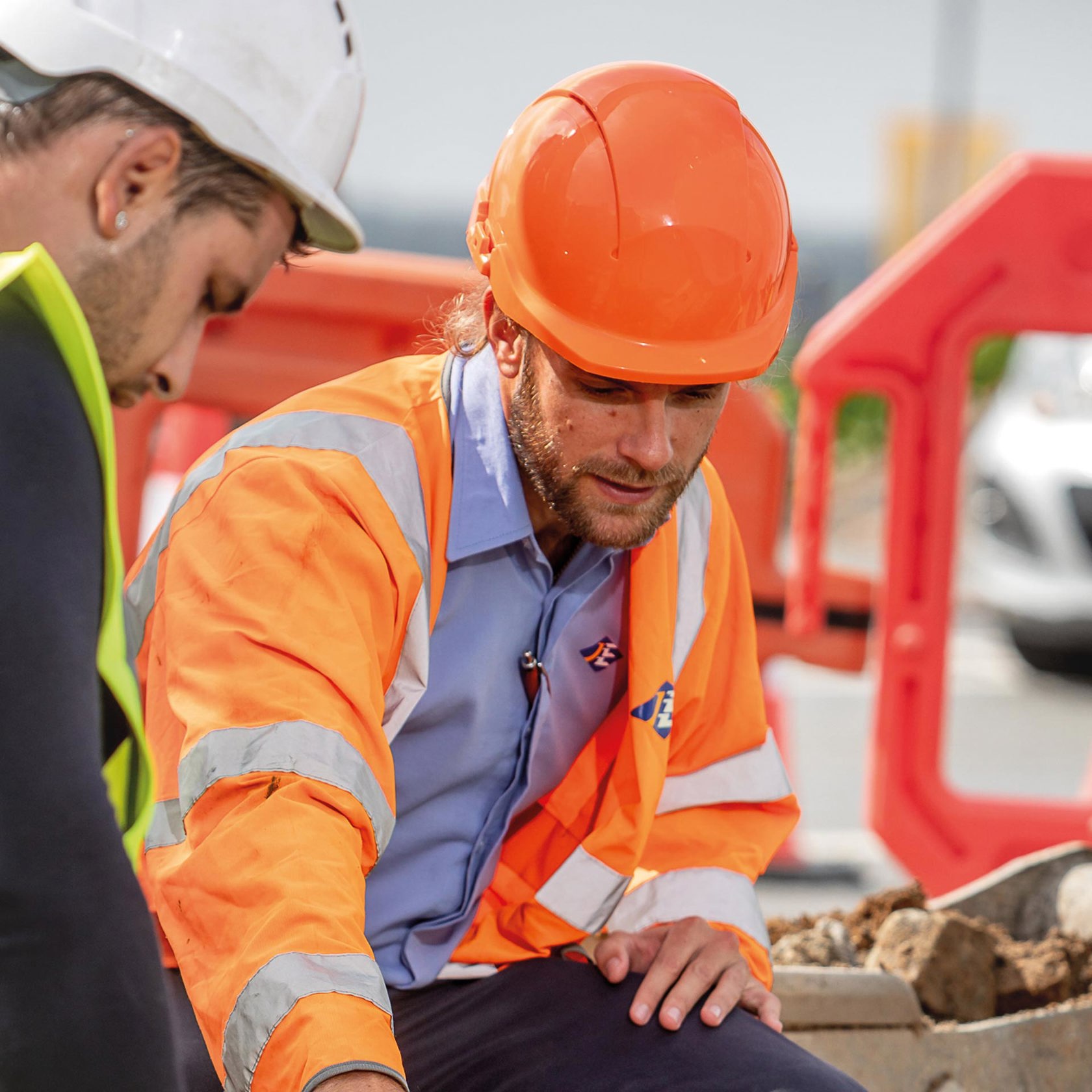 Sam Boleat gives advice to contractors during a constriction project.