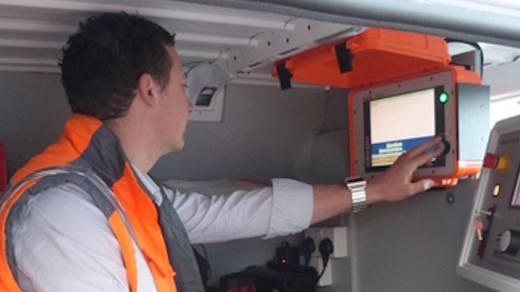 Man uses diagnostic equipment to find faults in electricity infrastructure