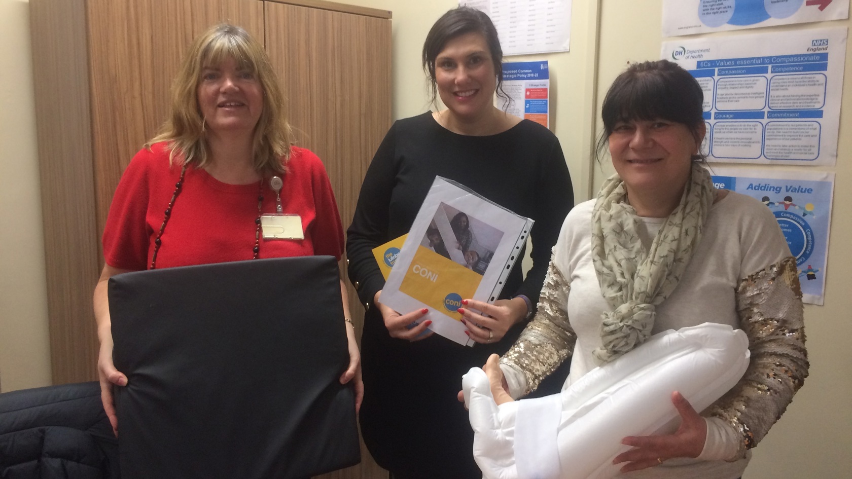 Family Nursing team with a variety of donated gifts