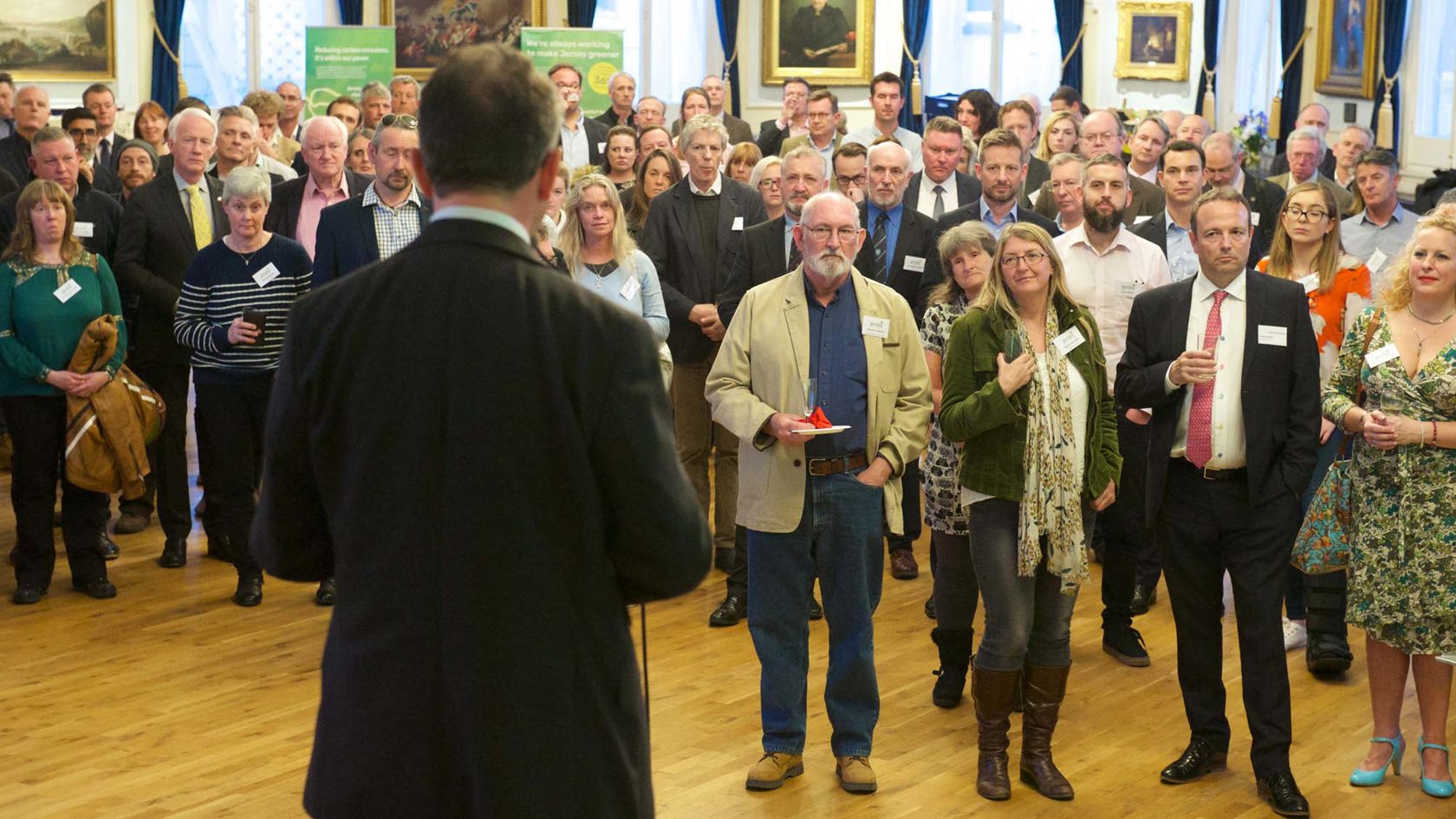 Jersey Electricity team member addresses public at Town Hall