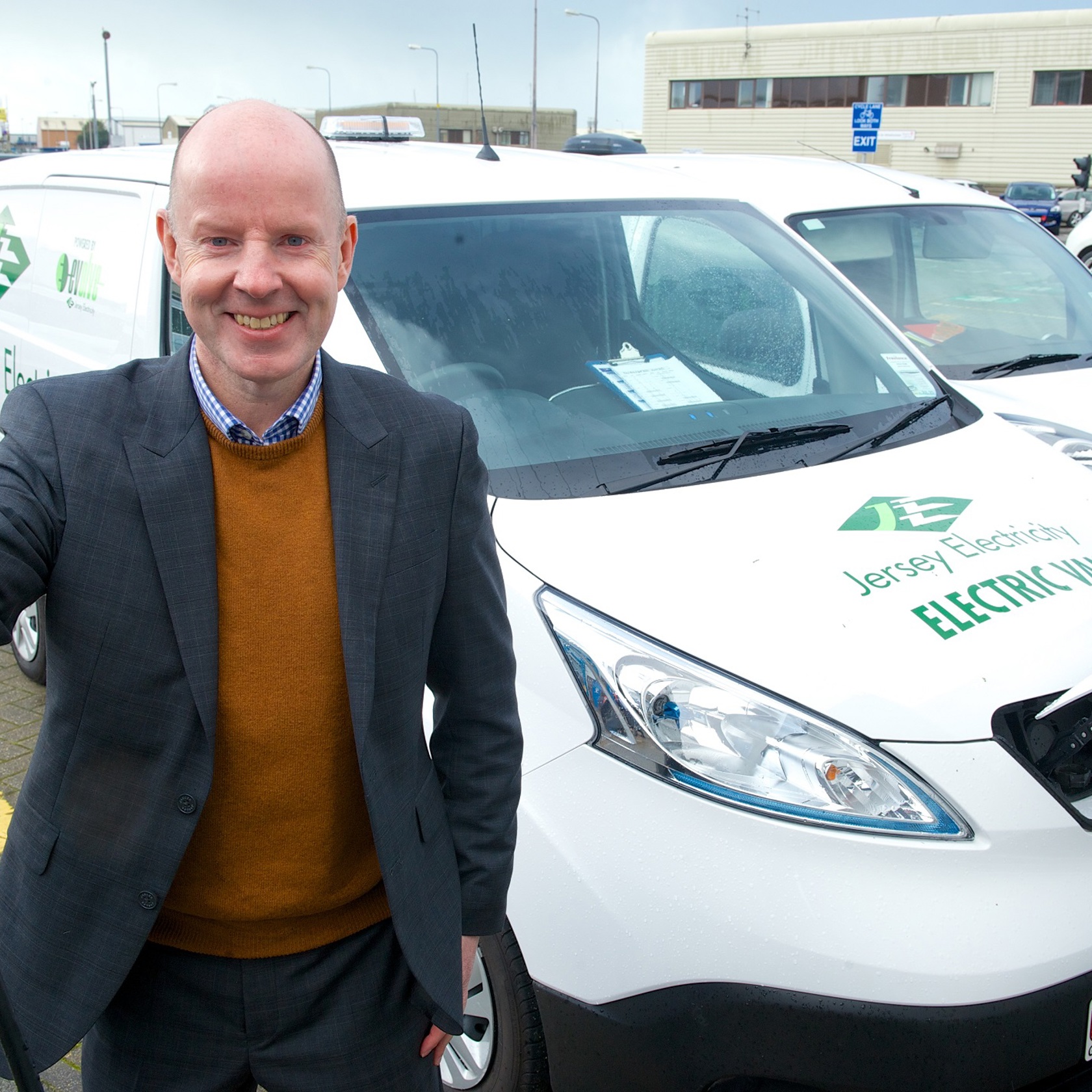 Mark Preece is pictured holding one of the Electric Vehicle charging plugs at La Collette.