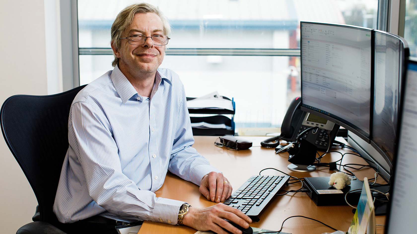 Scott Aldridge is photographed at his desk in the Jersey Electricity Powerhouse offices.