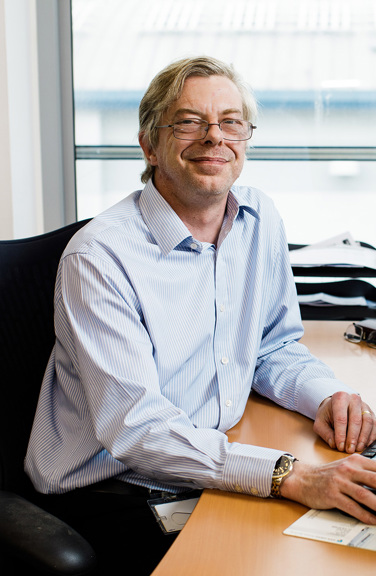 Scott Aldridge is photographed at his desk in the Jersey Electricity Powerhouse offices.