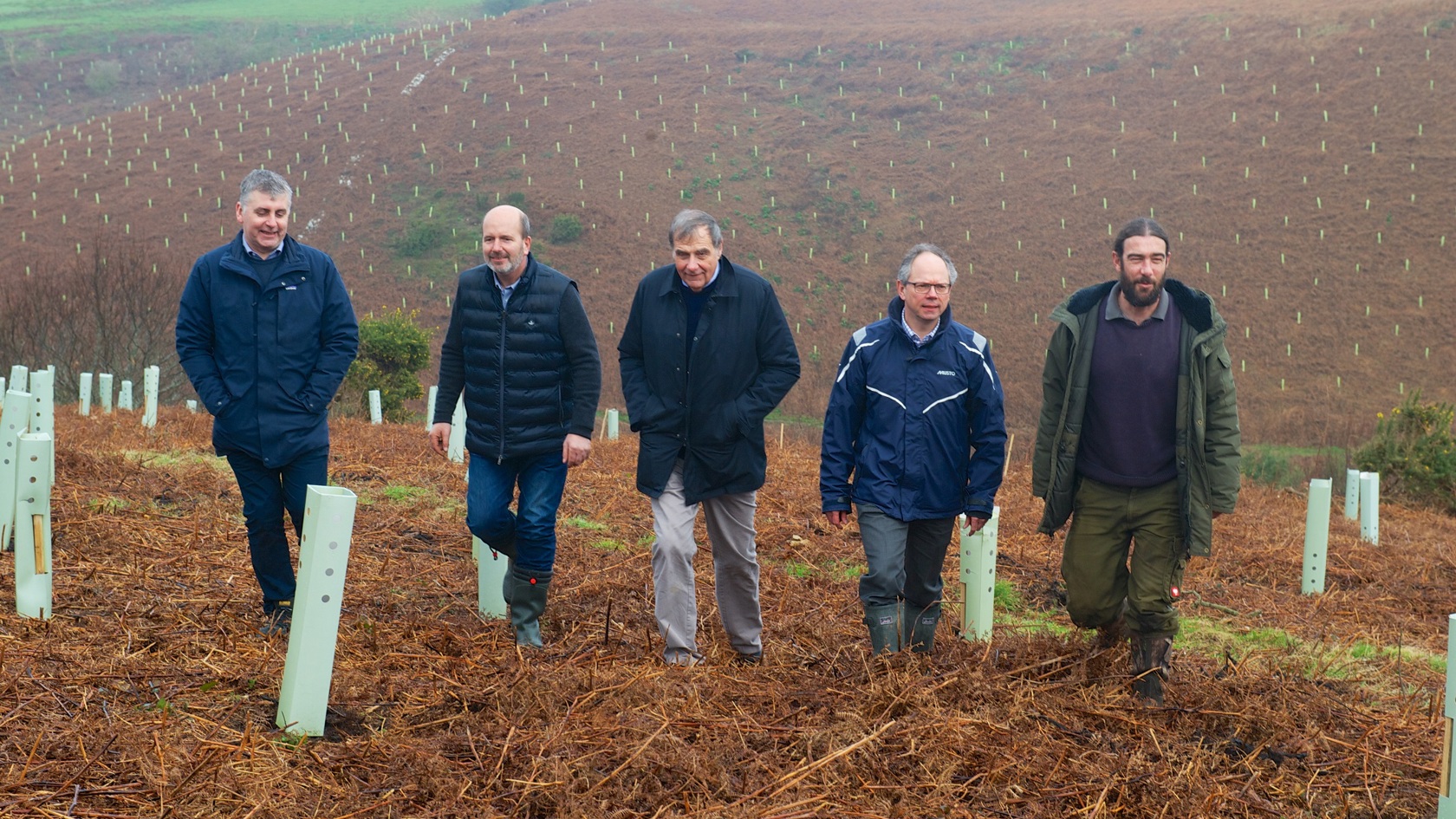 Group walk amongst planted trees at Mourier Valley