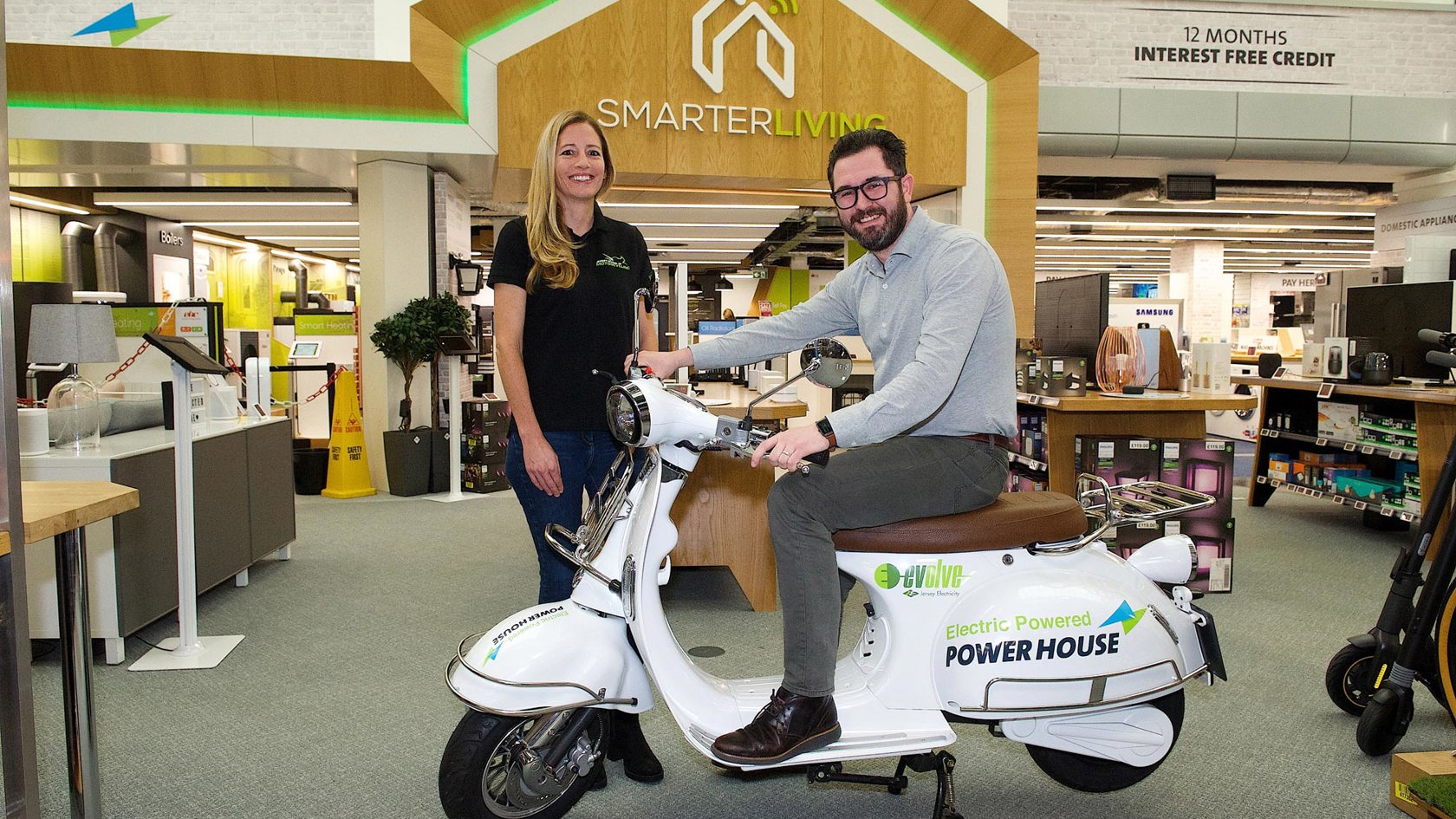 JE team pose with Electric Moped