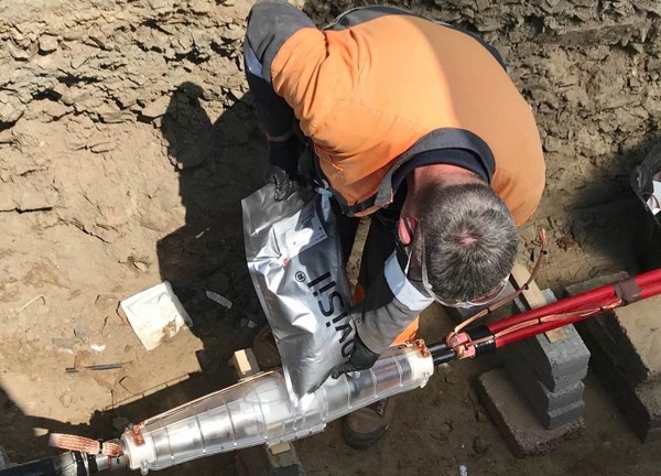 Engineer connects electric cables