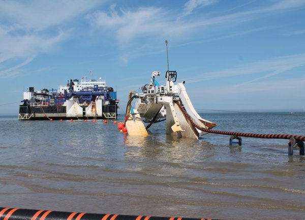 Ship lays subsea power cable