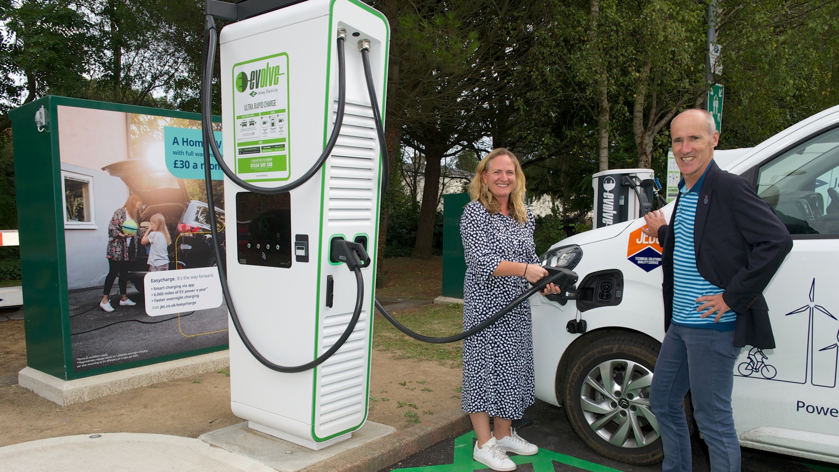​Assistant Minister for the Environment, Hilary Jeune, and Minister for the Environment, Jonathan Renouf, charge a Jersey electricity van with the Channel Island's first Ultra-Rapid EV charger