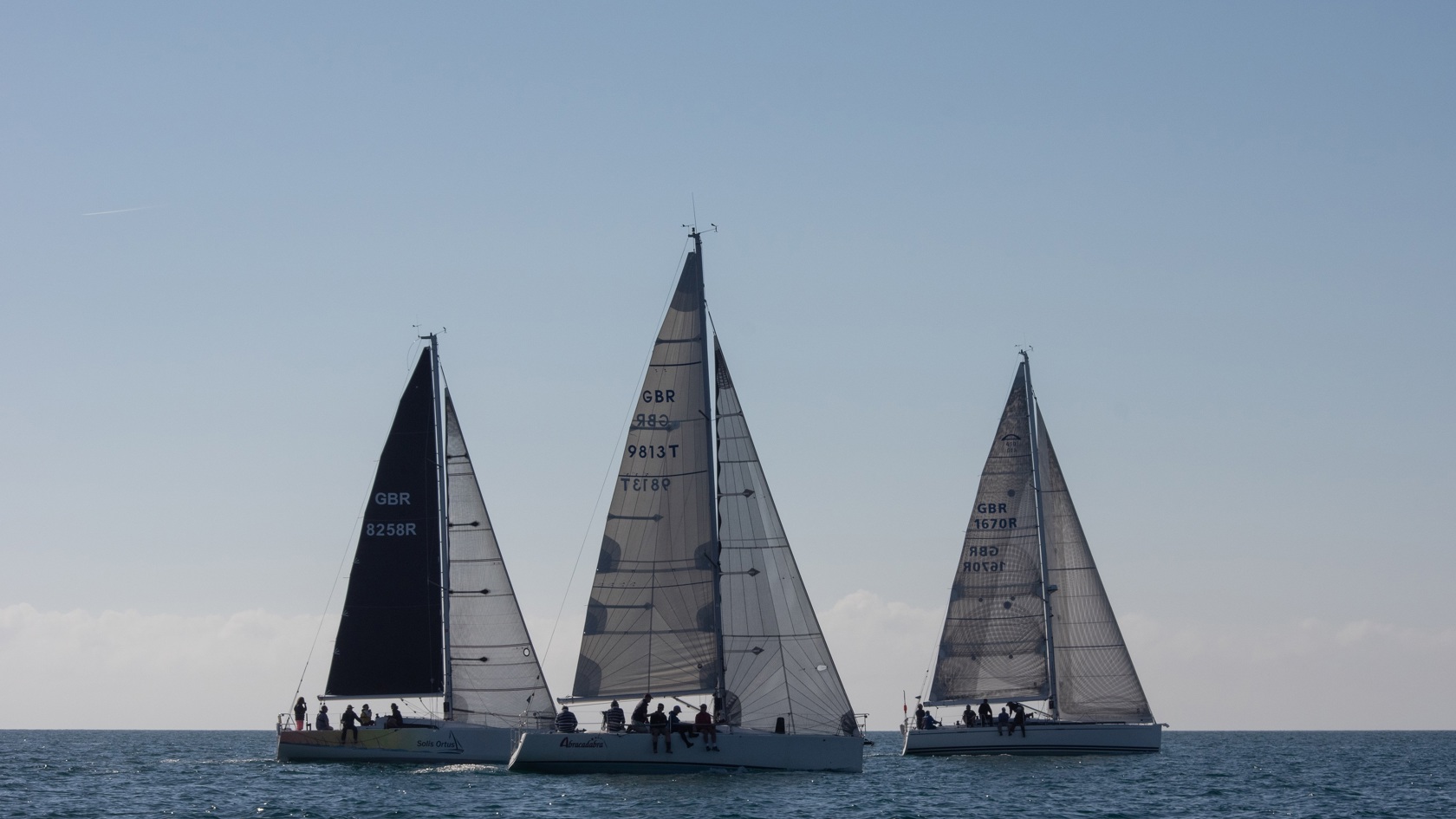 Three sailing boats racing