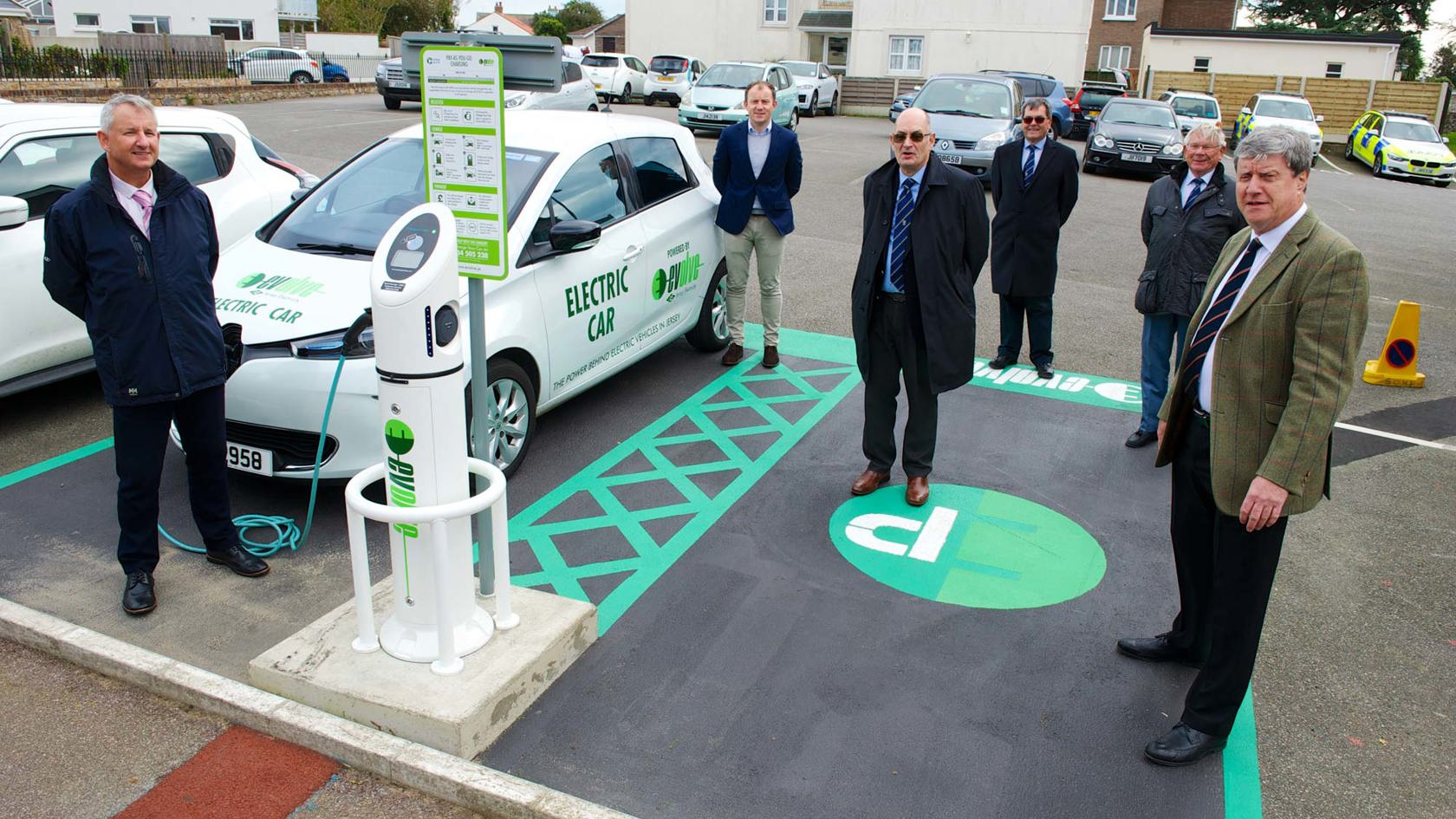 Peter Cadiou and parisioners display new electric charge points