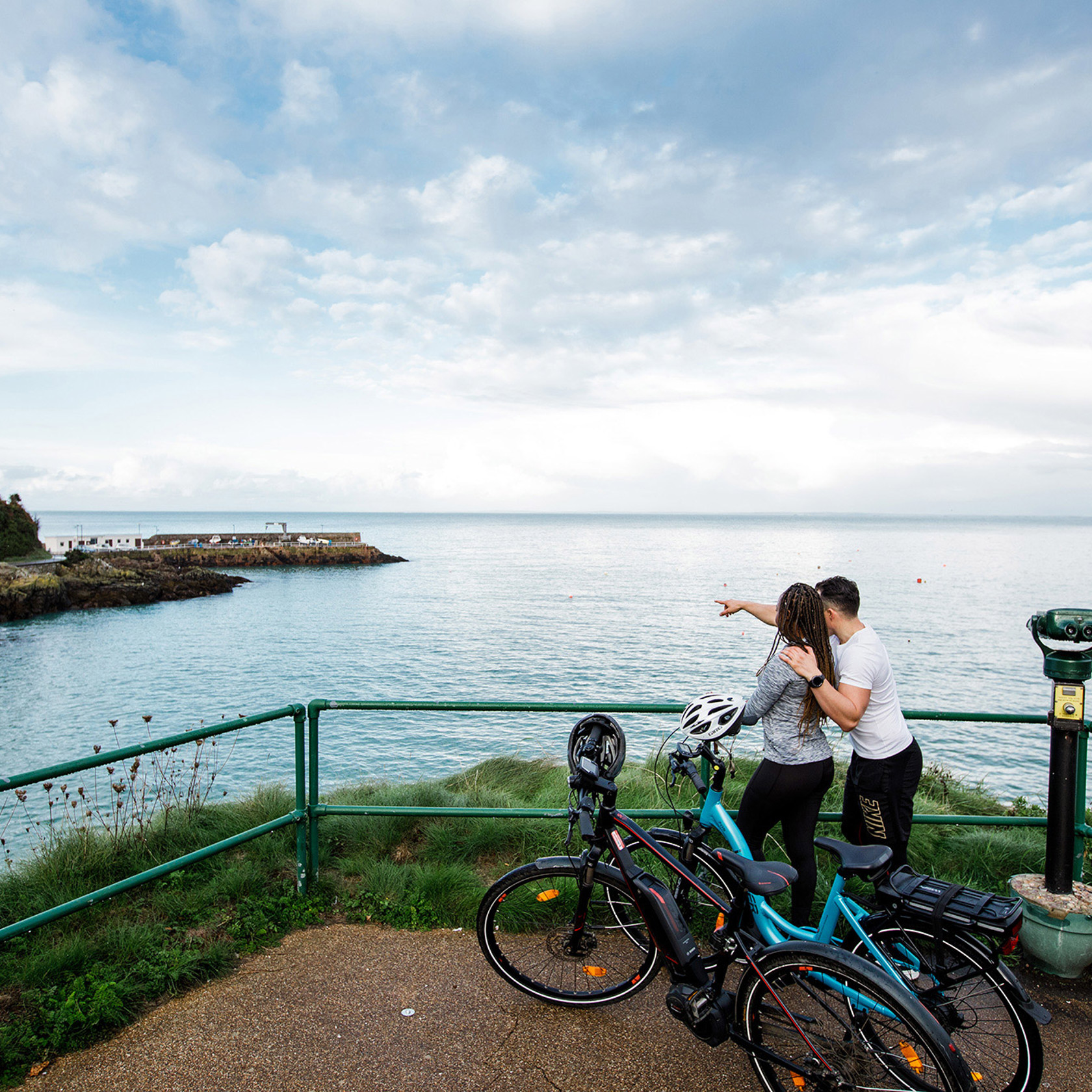  Two cyclists on electric bikes at Bouley Bay.
