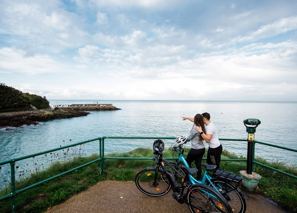 Two cyclists on electric bikes at Bouley Bay.