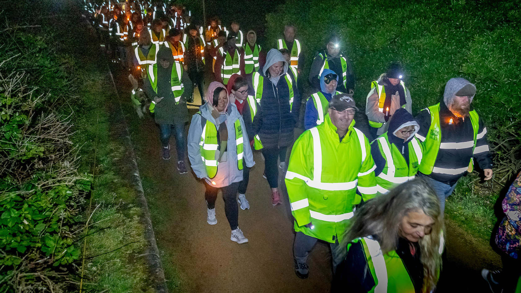 Walk into light participants walking along path