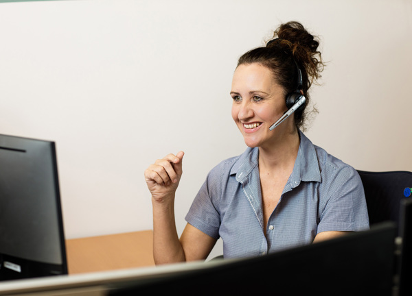 Kristy Page from the Customer Care team answers a call.