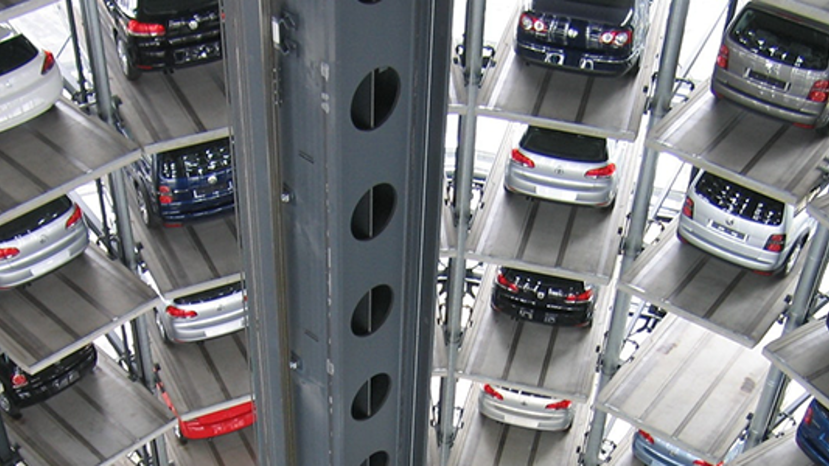 Electric vehicles stacked in a storage facility