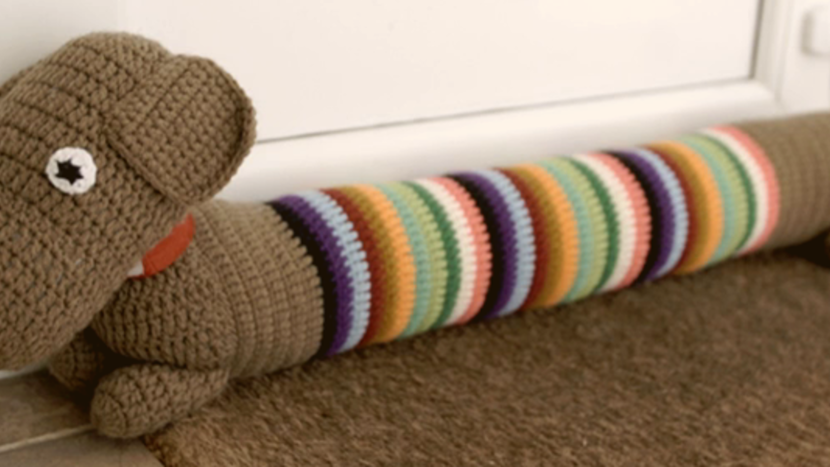 A draft excluder in the shape of a sausage dog
