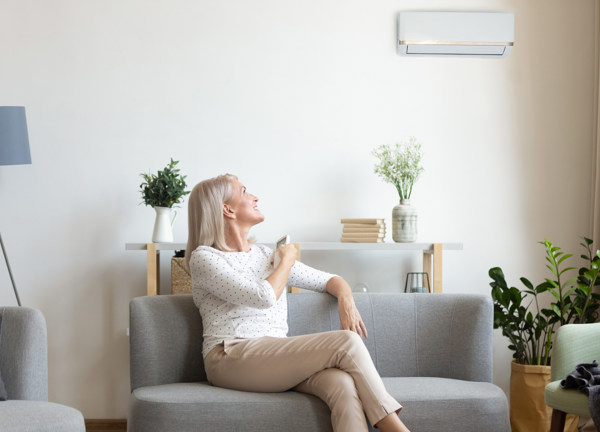 Woman using heat pump at home