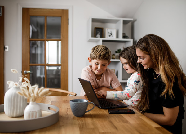 Positive Energy Family At Kitchen Table