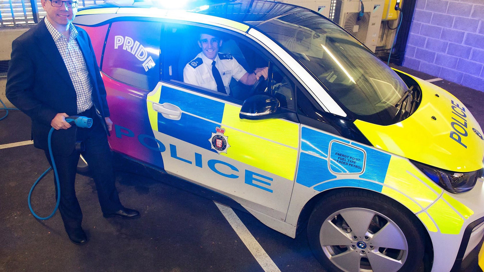Chris Ambler displays new electric police car