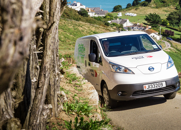 Electric Jersey Post van drives up a hill