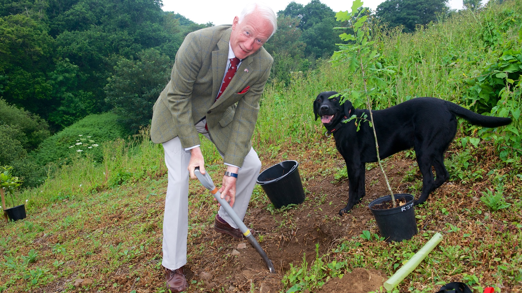 His Excellency preparing a hole to plant a tree at a new site on Bouley Bay Hill as part of the nationwide initiative, The Queen’s Green Canopy project.