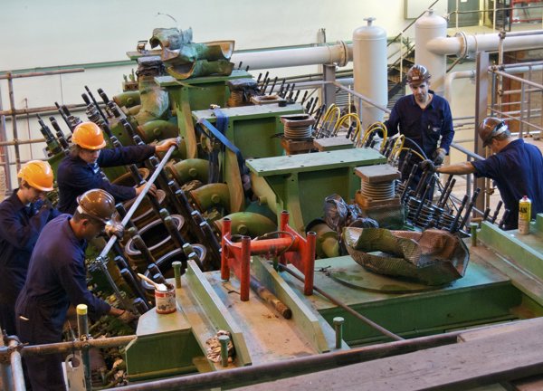 Engineers install a diesel generator at La Collette Power Station.