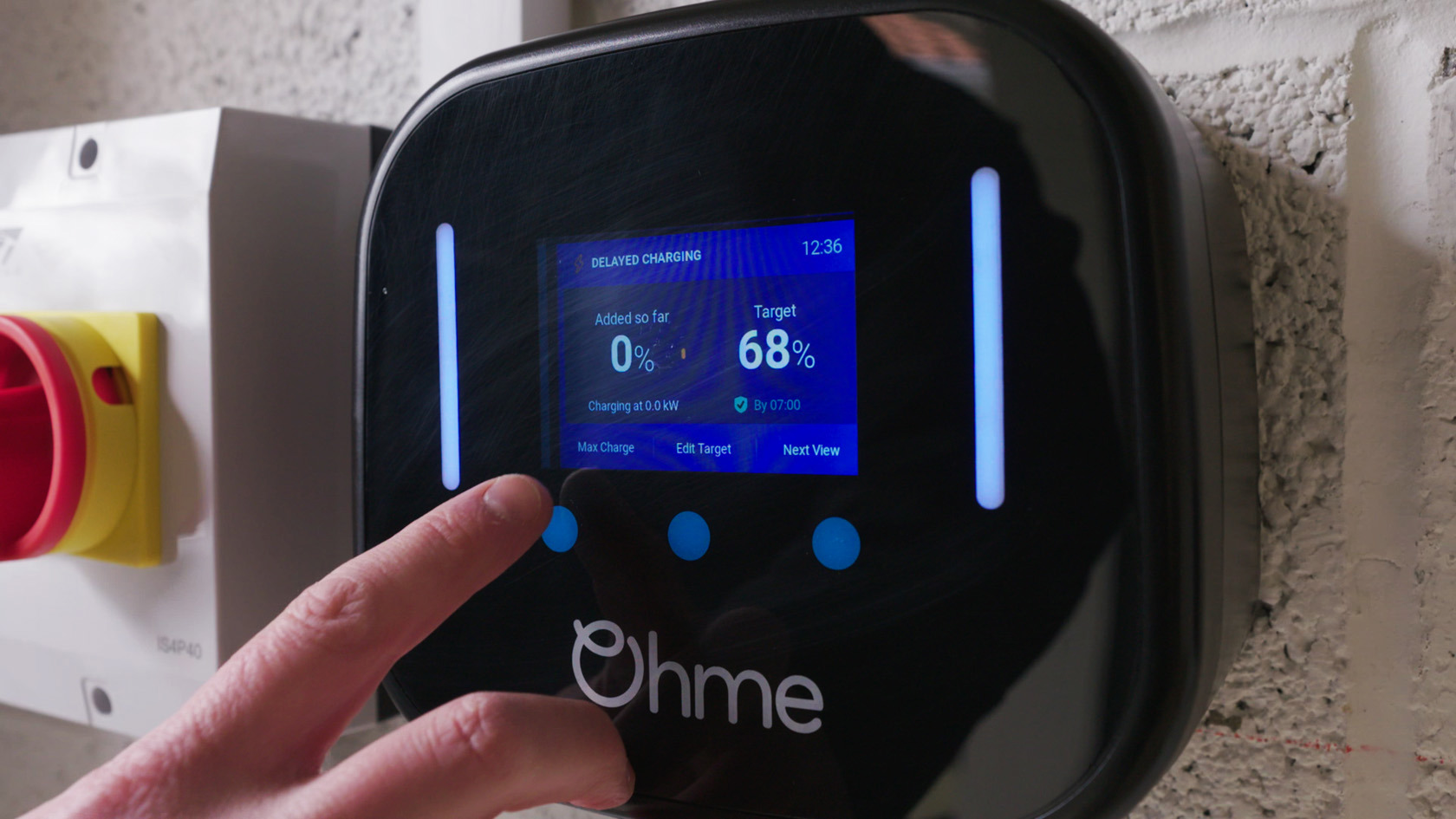 Person using an Ohme home electric car charger