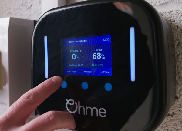 Person using an Ohme home electric car charger