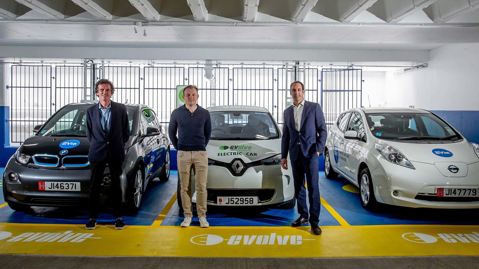 Team displaying new electric car charging points