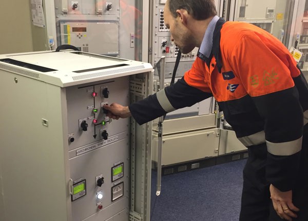 A Jersey Electricity engineer switches on the Normandie 1 cable for the first time.