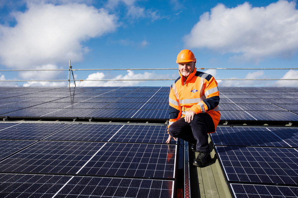 Phil Austin inspects the solar pv array on top the roof of Woodside Farm.