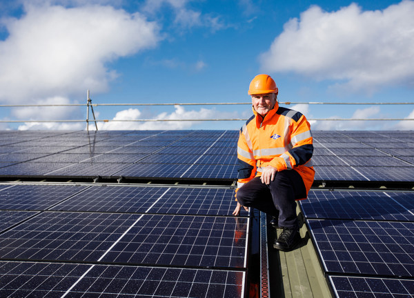 Phil Austin inspects the solar pv array on top the roof of Woodside Farm.