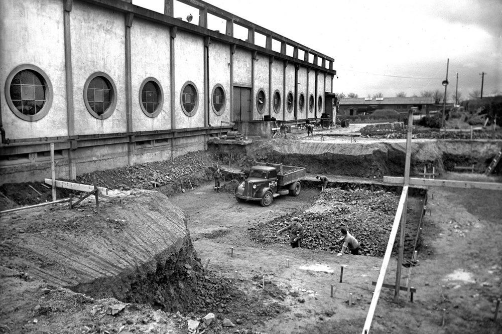 A historic photograph from the 1940s of the Queens Road powerstation extension project.