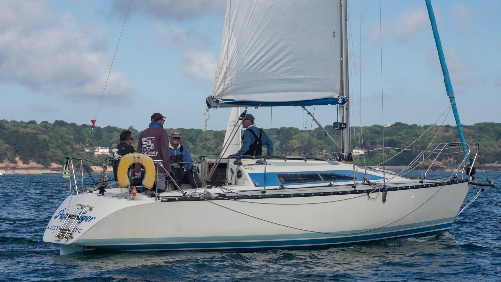 A small sailing boat racing in Jersey