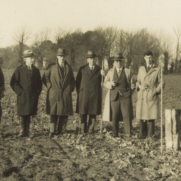 Jersey Electricity executives stand next to the boundary stone that marks the site the Powerhouse now stands on.