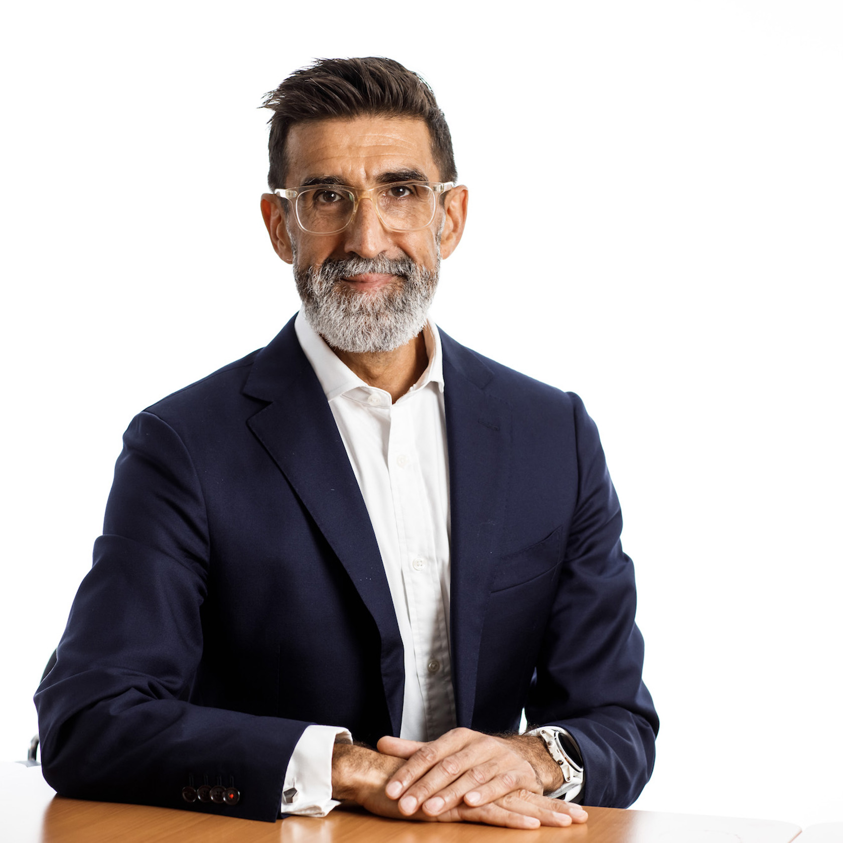 Andrew Welsby sitting at a table wearing a dark blazer and white shirt