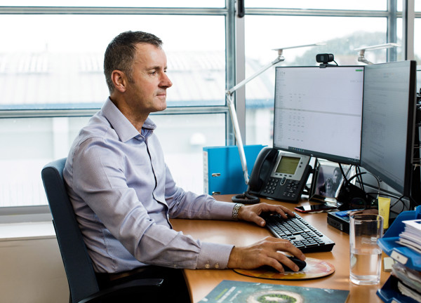 Andy Kemp working at his desk