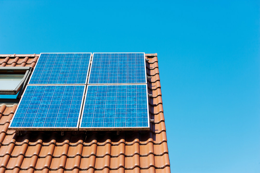 Four solar panels on a roof